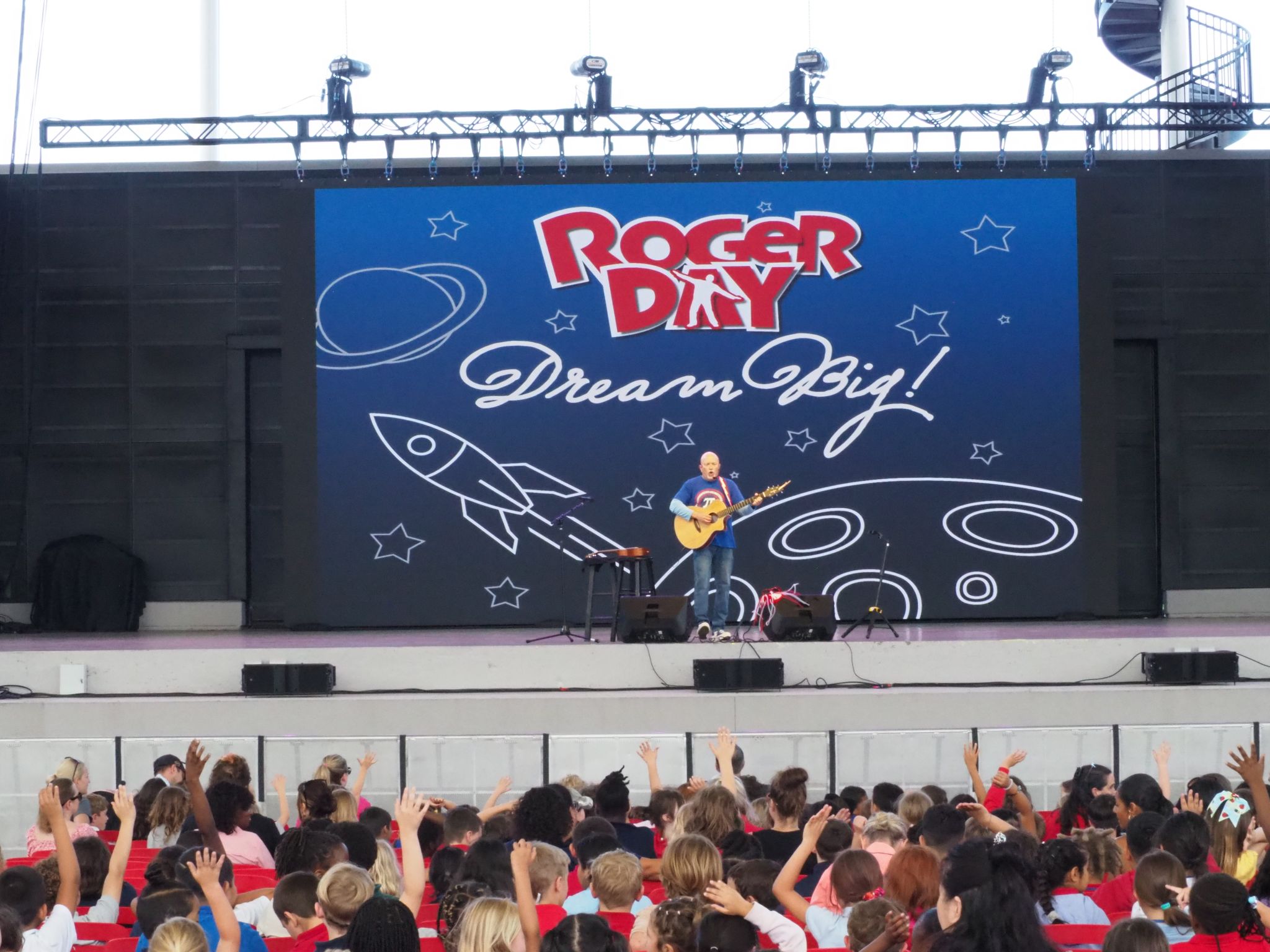 Roger Day performing on stage at The BayCare Sound in Downtown Clearwater to school children